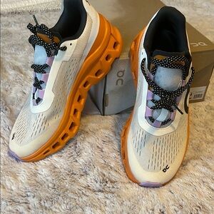 On Running Shoes with Orange Soles